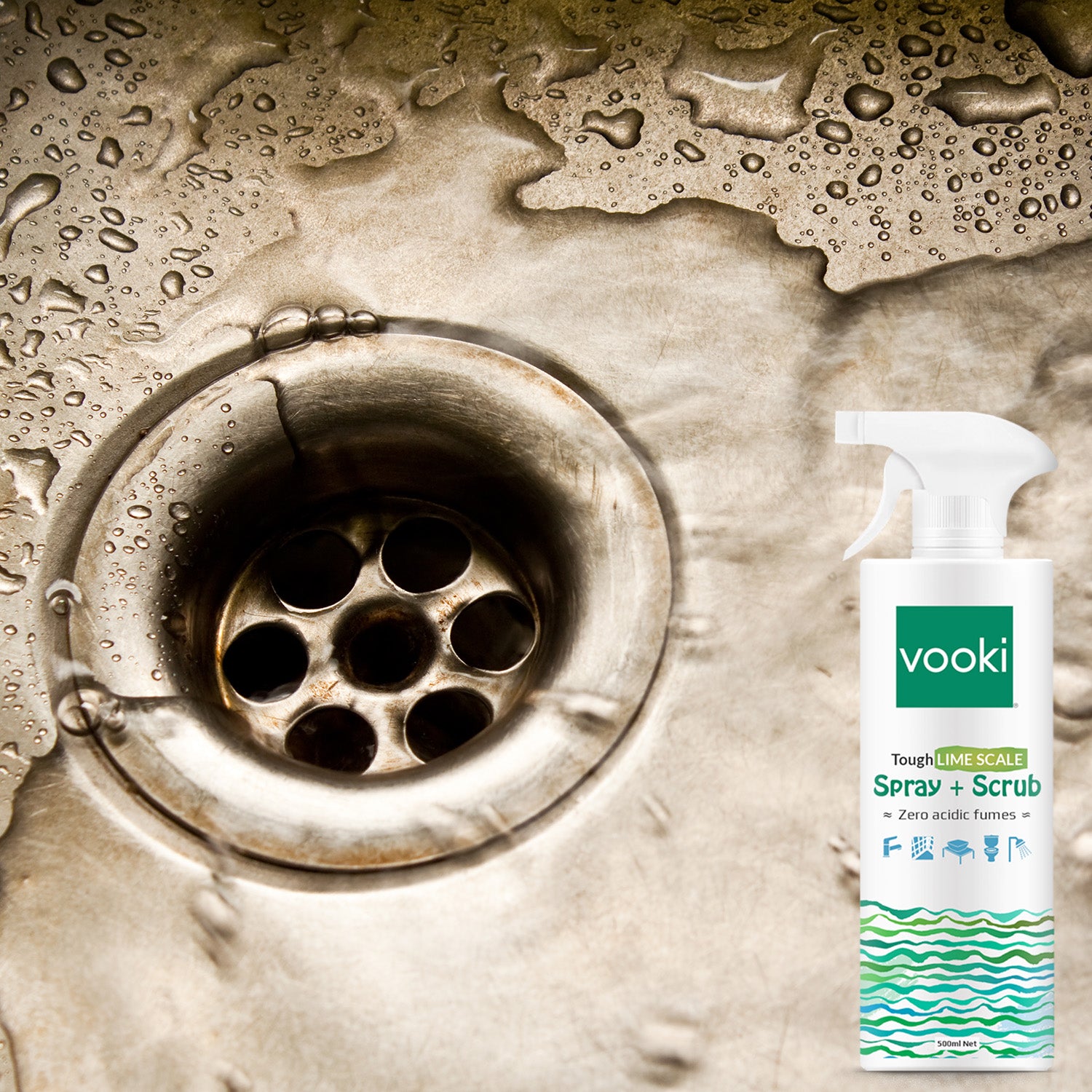 Spray cleaner bottle on sink drain.