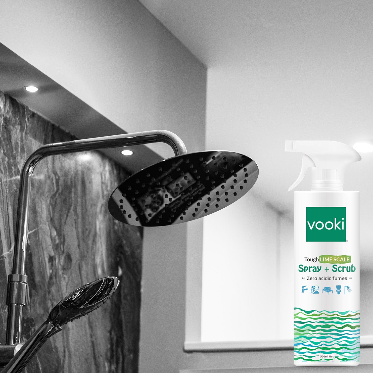 A shower head and vooki limescale spray+scrub bottle, essential for a refreshing and cleansing shower experience.