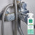 An image of vooki limescale spray+scrub bottle and on the background a shower hose attached 